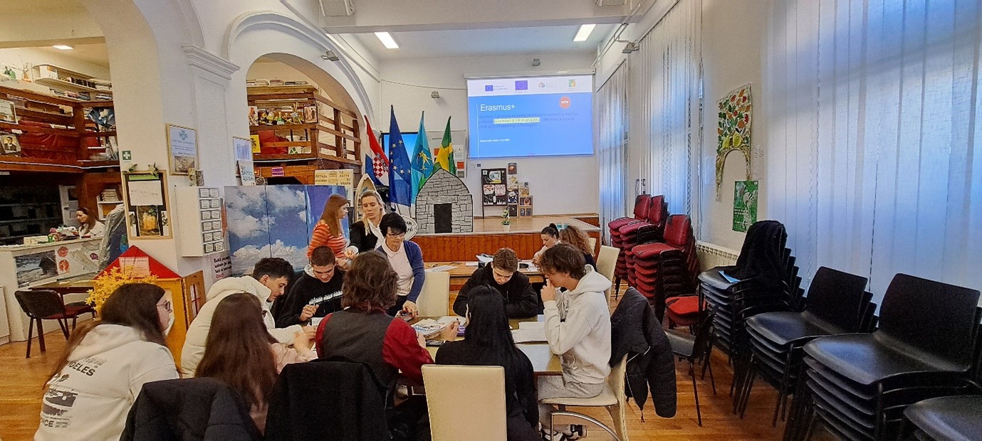 A group of people sitting at a tableAI-generated content may be incorrect.