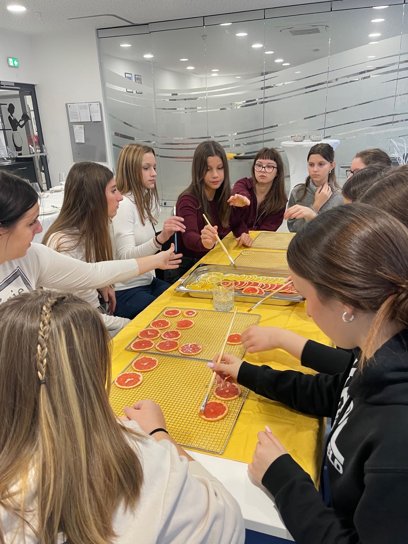A group of women sitting around a tableAI-generated content may be incorrect.